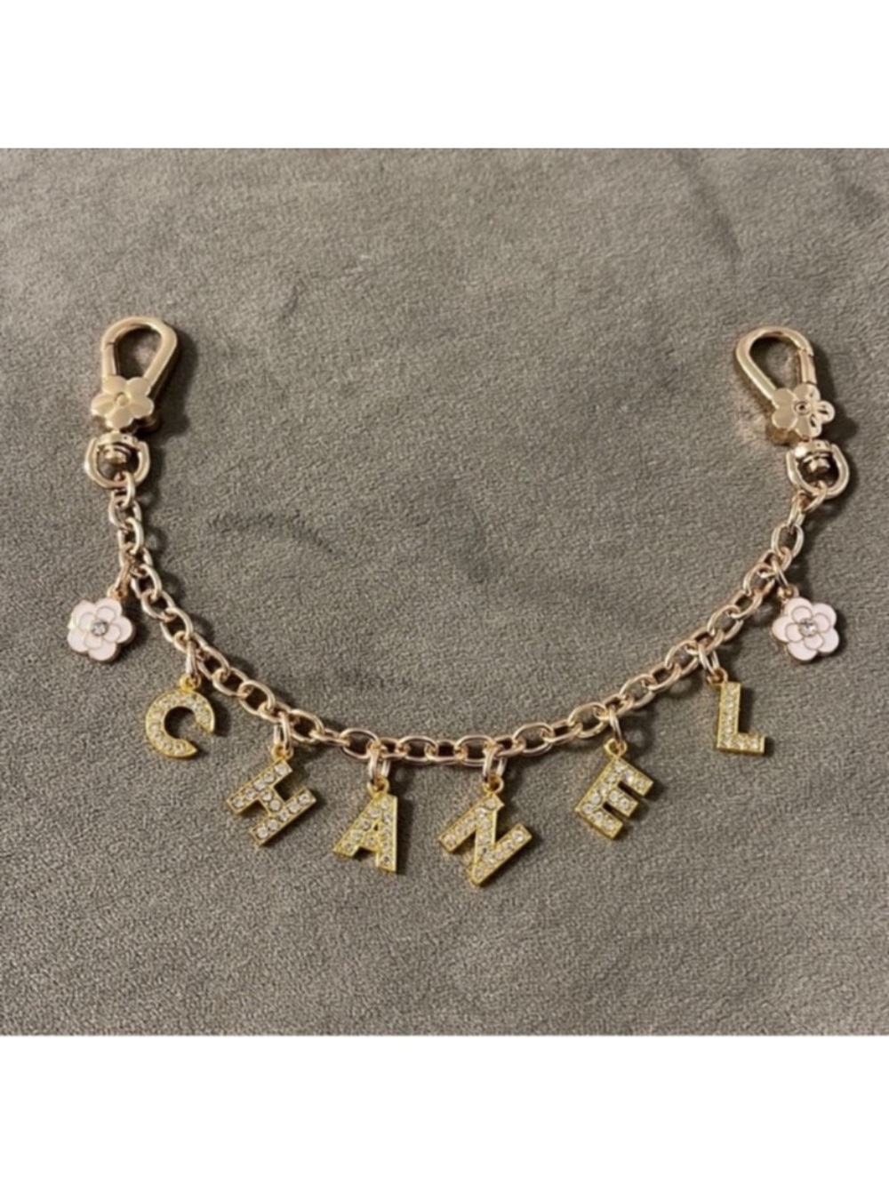 CHANEL Gold-Tone Letter Charm Chain with Pink Flower Accents